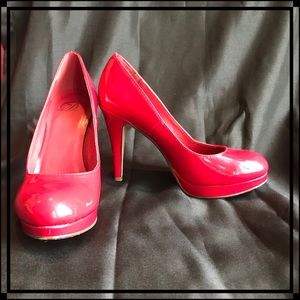 Red patent pumps